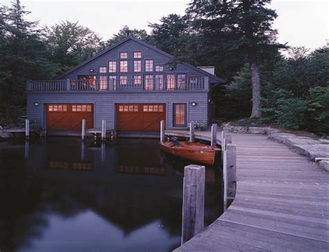 Striking red garage doors is the only curb appeal this lakeside beauty ...