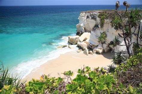 beaches in sumba - beautiful clear preserved ocean in sumba surf camp