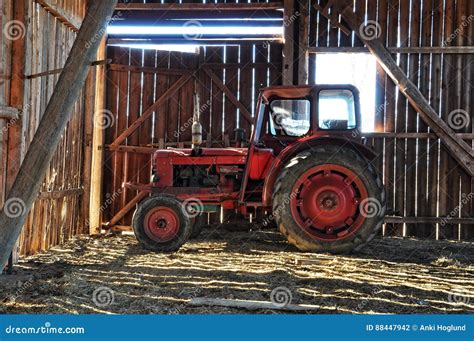 Red tractor in barn stock photo. Image of barn, rustic - 88447942