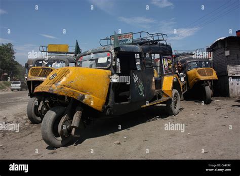 Vintage three wheeler Bajaj Tempo taxi buses await repair in Jammu ...