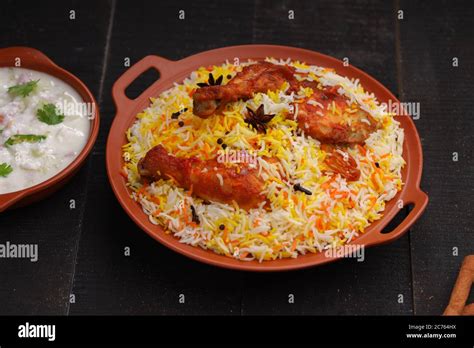 Chicken biryani , Tandoori chicken with basmathi rice and raita as side ...