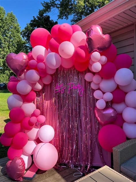 balloons and streamers decorate the front door of a house