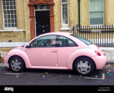 Pink Volkswagen beetle in a London street Stock Photo - Alamy