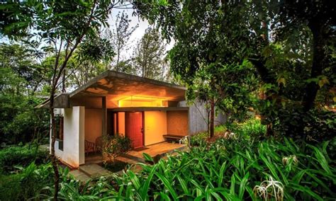 Modern luxury resort blends into the lush coffee hills of India