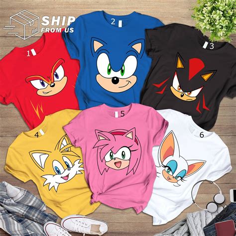 sonic the hedgehog t - shirts are on display with shoes and flowers in ...