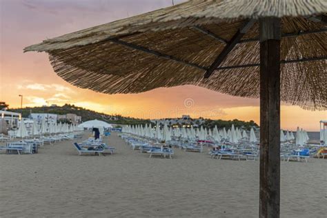 Umbrella in the Foreground in a Vieste Beach at Sunset in Summer Stock ...