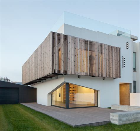 8 Buildings that Incorporate Wood Cladding and Kinetic Facades - Arch2O.com