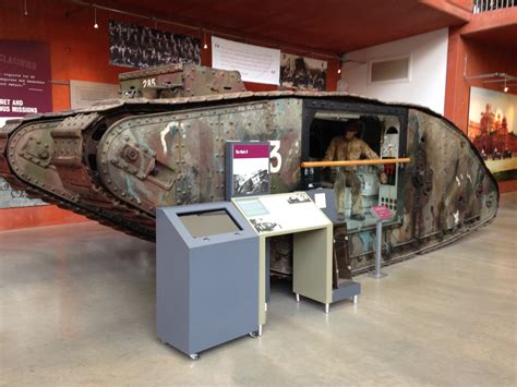 an old tank sitting on display in a museum