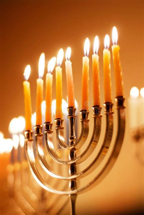 a menorah with many lit candles in it