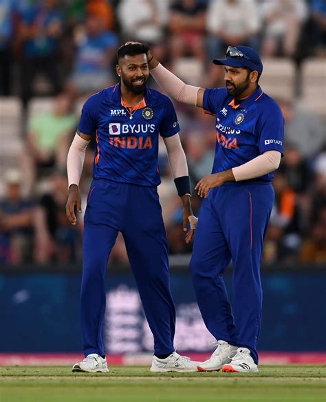 Hardik Pandya gets a pat from Rohit Sharma during his T20I best bowling ...