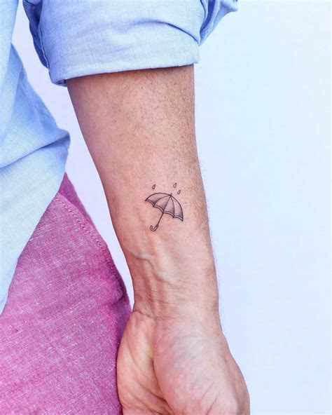 Cute little umbrella tattoo by Zaya Hastra - Tattoogrid.net