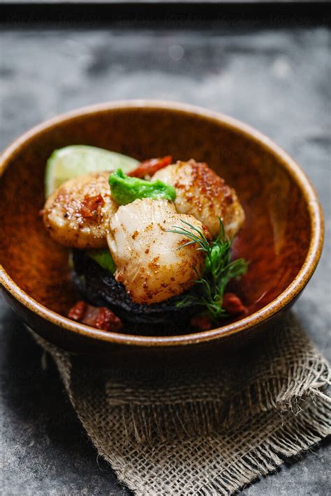 "Side View Of King Scallops With Black Pudding And Pea Puree,in A Bowl ...