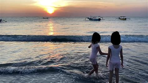 Silhouette of Kids Playing in Beach during Sunset Playing Sand Slow ...