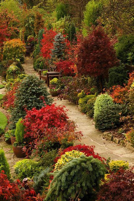 Path through the autumn upper garden of this beautiful English 'garden ...