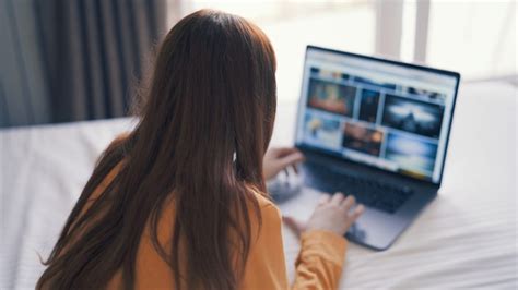 Premium Photo | Woman lying in bed with a laptop