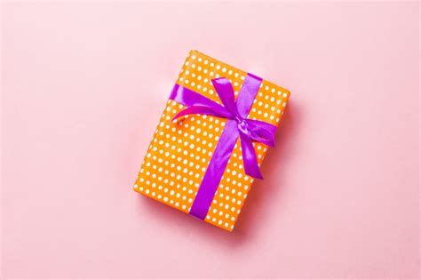 Premium Photo | Wrapped gift box with ribbon