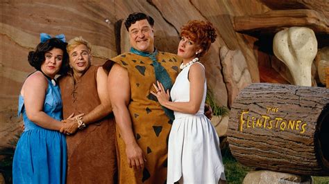 In The Flintstones (1994), Fred and Barney are portrayed living middle ...