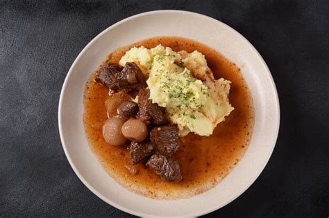 Premium Photo | Greek beef stifado. stew with beef, onion bulbs ...