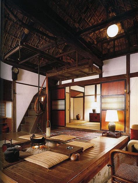 Interior of Japanese country house, with central fire pit and thatched ...