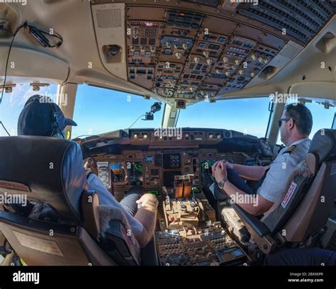 Cockpit view in Boeing 757-200 with pilot and co-pilot Stock Photo - Alamy