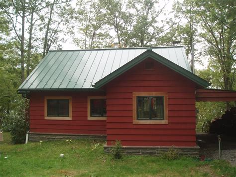 House With Green Metal Roof Colors