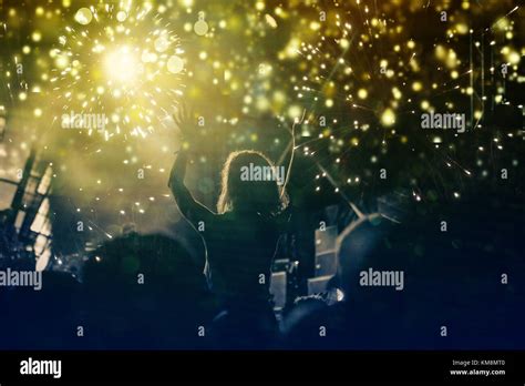 new Year concept - cheering crowd and fireworks Stock Photo - Alamy