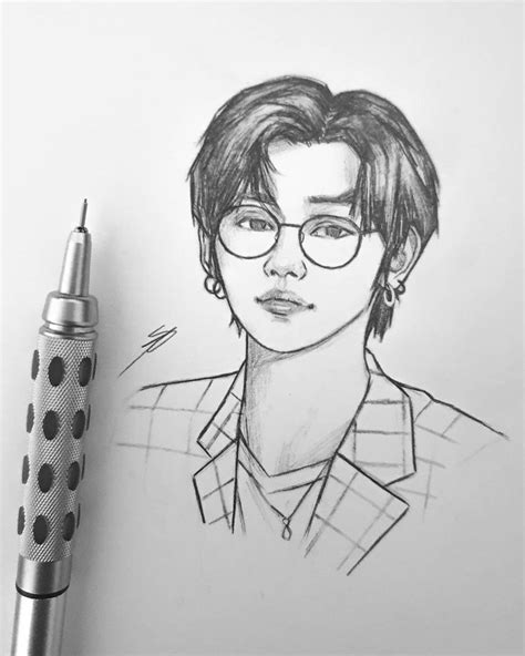 a pencil drawing of a man with glasses and a polka dot pen next to it