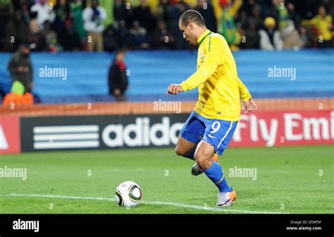 Luis Fabiano of Brazil scores the 2-0 during the 2010 FIFA World Cup ...