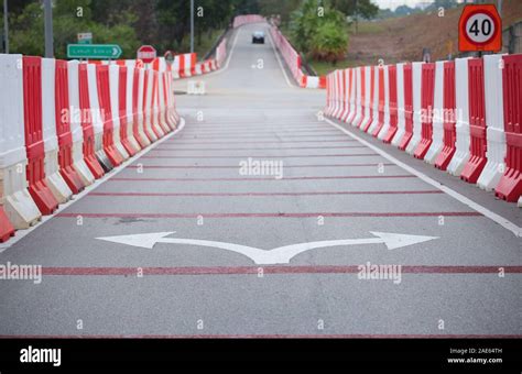 Plastic road divider at a crossroad Stock Photo - Alamy