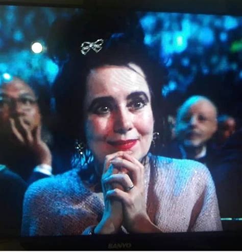 Mary Poole listening to Robert Smith's speech from the stage during the ...