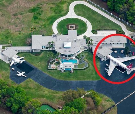 This is John Travolta's impressive house with a private airport ...