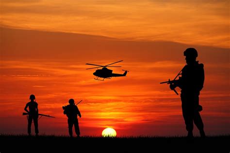 Soldiers silhouette at sunset Wall Mural • Pixers® • We live to change