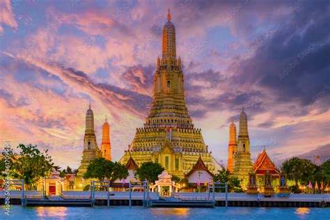 Wat Arun temple Bangkok during sunset in Thailand. Chao praya river ...