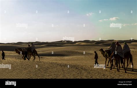 Camel ride in Sahara desert in Tunisia Stock Photo - Alamy