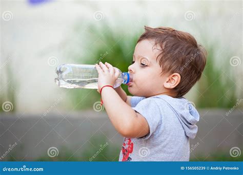 Boy Drinking Water from a Bottle Stock Image - Image of blue, hand ...