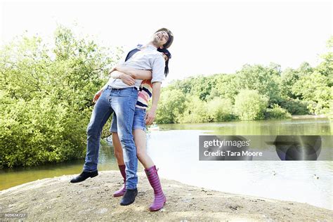 Woman Lifting Man In Air High-Res Stock Photo - Getty Images