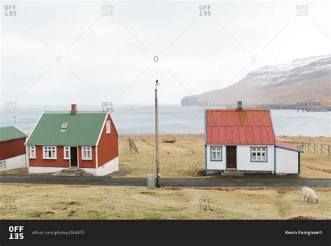 Small cottages along the edge of a bay in the Faroe Islands stock photo ...