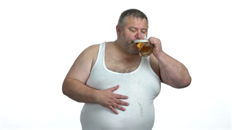 Happy man drinking beer on white background. Obese guy drinking beer ...