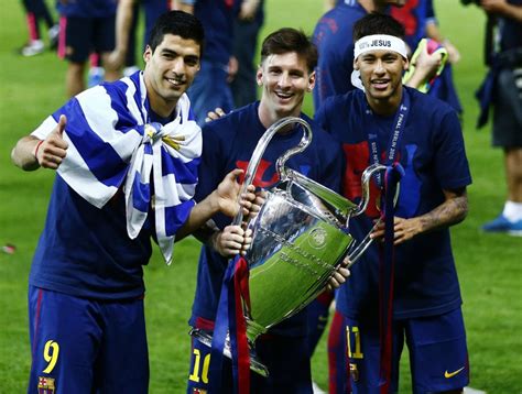 Suarez, Messi and Neymar holding the UEFA Champions League trophy in ...