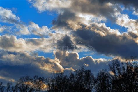 The Sunset Sky is Blue with Dark and Light Clouds. Stock Image - Image ...