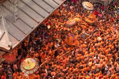 Premium Photo | A crowd of people in orange colored clothing are ...