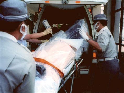 A photo of a plastic wrapped Hisashi Ouchi being transferred after the ...