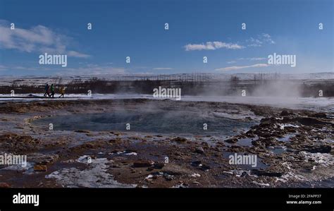 View of steaming water pool of famous geyser Strokkur (Icelandic "churn ...