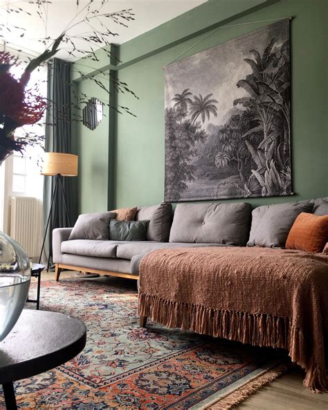 Gray tapestry over a gray sofa, green walls & a beautiful green & clay ...