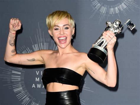 A Guide to Miley Cyrus's Most Meaningful Tattoos | POPSUGAR Beauty