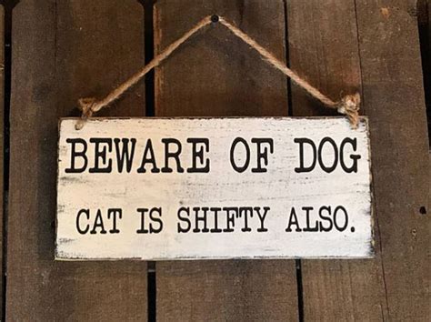 Funny Beware of the Dog Signs & Dogs Behind Them