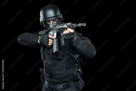 Spec ops police officer SWAT in black uniform and face mask Stock Photo ...