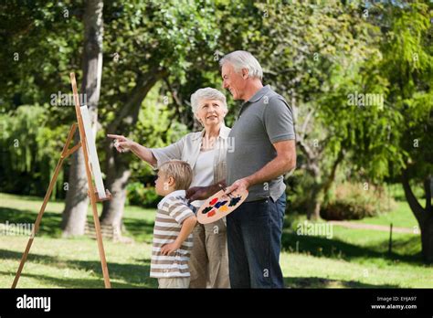 Grandmother painting grandson hi-res stock photography and images - Alamy