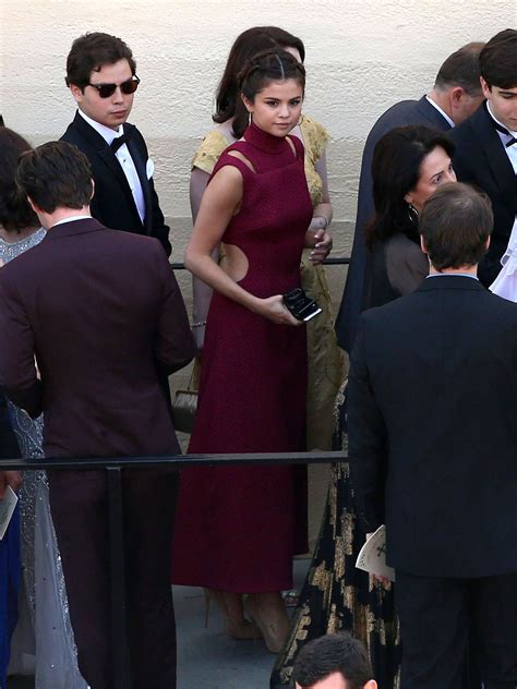 April 21: Selena at David Henrie's wedding in Los Angeles, California ...