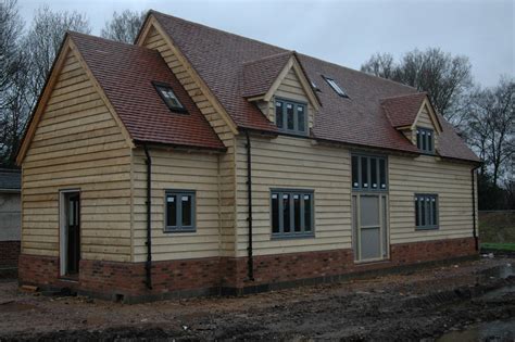 Border Oak - Weatherboarded barn style home under construction ...